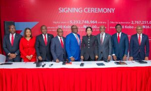 Zenith Bank Plc is set to raise N290 billion through a combination of a Rights Issue and a Public Offer in compliance with the revised minimum capital requirements for Nigerian commercial banks introduced by the Central Bank of Nigeria (CBN). 
This announcement was made during the Zenith Bank Rights Issue/Public Offer Signing Ceremony held yesterday, July 29, 2024, at The Civic Centre, Victoria Island, Lagos. This event marks a significant milestone in the bank’s previously announced capital-raising programme, aimed at bolstering its capital base and supporting its growth trajectory across its banking and non-banking subsidiaries.
The Rights Issue offers 5,232,748,964 ordinary shares of 50 Kobo each at N36.00 per share, while the Offer for Subscription presents 2,767,251,036 ordinary shares of 50 Kobo each at N36.50 per share. The Rights Issue affords existing shareholders the opportunity to purchase additional shares in proportion to their current holdings and is being offered on the basis of one new ordinary share for every six existing ordinary shares held as of Wednesday, July 24, 2024. Conversely, the public offer for subscription is open to the general public and aims to attract new investors.
Speaking at the signing ceremony, the Group Managing Director/CEO of Zenith Bank Plc, Dame (Dr.) Adaora Umeoji, OON, expressed enthusiasm about the Rights Issue and Public Offer, stating, “Today, we signed  the transaction documents with respect to Zenith Bank’s N290 billion Rights Issue and Public Offer. This is slightly above the N230 billion required for us to meet the CBN’s minimum recapitalisation requirement. We are extremely pleased with the level of enthusiasm we have already seen from our existing shareholders for the Rights Issue. Beyond existing shareholders, incorporating a public offer is crucial to ensure that our customers, who are not yet shareholders, can have the opportunity to join in the ownership of this premium brand.
“In terms of Tier-1 Capital, Zenith Bank has been adjudged by The Banker, Financial Times to be number one in Nigeria and the only Nigerian Bank in the top 600 banks globally. Over the years, we have consistently rewarded our esteemed shareholders. Specifically, in the last five years, we have maintained the record as the highest dividend-paying Bank in Nigeria. In 2023, we set a record as the only Nigerian Bank to pay a dividend of N4 per share.” She added that the proceeds from the capital raise will be channelled towards expanding banking operations across Africa and internationally, investing in technology infrastructure, and supporting working capital on an ongoing basis. She expressed optimism that given Zenith Bank’s track record of profitability and consistency in creating wealth for shareholders, the capital raise will be a resounding success. She assured prospective investors that Zenith Bank will maintain its leadership in dividend payout in the years ahead and encouraged them to invest in value and invest in Zenith Bank.
She also expressed her profound gratitude to the Founder and Chairman, Dr. Jim Ovia CFR, whose vision over 34 years ago laid the foundation for a reputable, dominant, globally recognised financial institution known for innovation, superior performance, and the creation of premium value for all stakeholders.
The Chief Executive of Stanbic IBTC Capital Limited, Mr. Oladele Sotubo, commended the management of Zenith Bank for their commitment to the transaction, which provides an opportunity for existing shareholders to consolidate their position and welcomes new investors to join the journey towards the future of Zenith Bank. He also expressed gratitude for the opportunity for Stanbic IBTC Capital Limited to lead and guide the execution of the transactions. Speaking further, he said, “A combined offer that is both a Rights Issue and a Public Offer confirms Zenith Bank’s position as a pacesetter and a role model, which will undoubtedly spur more transactions in the capital market.”
The lead issuing house for the Rights Issue and Public Offer is Stanbic IBTC Capital Limited, with joint issuing houses including Quantum Zenith Capital & Investments Limited, CardinalStone Partners Limited, Meristem Capital Limited, Chapel Hill Denham Advisory Limited, Coronation Merchant Bank Limited and Vetiva Advisory Services Limited. The Offer will open on Thursday, August 1, 2024, and close on Monday, September 9, 2024.
Zenith Bank has provided a robust suite of platforms for the Rights Issue and Public Offer. Applications can be made through any of Zenith Bank’s electronic channels: Zenith Bank Internet Banking, Zenith Bank Mobile Application, Zenith Bank Corporate Internet Banking, Zenith Bank Branches nationwide and NGX Invest platform.
The Zenith Bank E-Application channels have been integrated into the NGX Invest platform, which can be accessed at https://invest.ngcgroup.com, and are available to all applicants and authorised receiving agents to submit applications on behalf of applicants. The electronic channels democratises the distribution of public offers and rights issues in the capital market, enabling investors to subscribe with the click of a button.

R – L: Executive Director, Zenith Bank Plc, Mr. Louis Odom; Executive Director, Mr. Akin Ogunranti; Managing Director/Chief Executive, Vetiva Advisory Ltd, Mr Chuka Eseka; Group Managing Director/Chief Executive, Zenith Bank Plc, Dame (Dr.) Adaora Umeoji, OON; Group Managing Director, Meristem Securities Ltd, Mr Wole Abegunde; Company Secretary, Mr. Micheal Otu; Executive Director, Stanbic IBTC Capital Limited, Mrs Oyindamola Akinyemi; Executive Director, Mr. Henry Oroh; Executive Director, Mrs. Adobi Nwapa; and Executive Director, Mr. Adamu Lawani during the Zenith Bank Capital Raising Signing Ceremony at the Civic Centre, Victoria Island, Lagos, yesterday.
