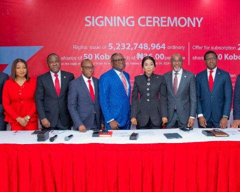 Zenith Bank Plc is set to raise N290 billion through a combination of a Rights Issue and a Public Offer in compliance with the revised minimum capital requirements for Nigerian commercial banks introduced by the Central Bank of Nigeria (CBN). This announcement was made during the Zenith Bank Rights Issue/Public Offer Signing Ceremony held yesterday, July 29, 2024, at The Civic Centre, Victoria Island, Lagos. This event marks a significant milestone in the bank’s previously announced capital-raising programme, aimed at bolstering its capital base and supporting its growth trajectory across its banking and non-banking subsidiaries. The Rights Issue offers 5,232,748,964 ordinary shares of 50 Kobo each at N36.00 per share, while the Offer for Subscription presents 2,767,251,036 ordinary shares of 50 Kobo each at N36.50 per share. The Rights Issue affords existing shareholders the opportunity to purchase additional shares in proportion to their current holdings and is being offered on the basis of one new ordinary share for every six existing ordinary shares held as of Wednesday, July 24, 2024. Conversely, the public offer for subscription is open to the general public and aims to attract new investors. Speaking at the signing ceremony, the Group Managing Director/CEO of Zenith Bank Plc, Dame (Dr.) Adaora Umeoji, OON, expressed enthusiasm about the Rights Issue and Public Offer, stating, “Today, we signed the transaction documents with respect to Zenith Bank’s N290 billion Rights Issue and Public Offer. This is slightly above the N230 billion required for us to meet the CBN’s minimum recapitalisation requirement. We are extremely pleased with the level of enthusiasm we have already seen from our existing shareholders for the Rights Issue. Beyond existing shareholders, incorporating a public offer is crucial to ensure that our customers, who are not yet shareholders, can have the opportunity to join in the ownership of this premium brand. “In terms of Tier-1 Capital, Zenith Bank has been adjudged by The Banker, Financial Times to be number one in Nigeria and the only Nigerian Bank in the top 600 banks globally. Over the years, we have consistently rewarded our esteemed shareholders. Specifically, in the last five years, we have maintained the record as the highest dividend-paying Bank in Nigeria. In 2023, we set a record as the only Nigerian Bank to pay a dividend of N4 per share.” She added that the proceeds from the capital raise will be channelled towards expanding banking operations across Africa and internationally, investing in technology infrastructure, and supporting working capital on an ongoing basis. She expressed optimism that given Zenith Bank’s track record of profitability and consistency in creating wealth for shareholders, the capital raise will be a resounding success. She assured prospective investors that Zenith Bank will maintain its leadership in dividend payout in the years ahead and encouraged them to invest in value and invest in Zenith Bank. She also expressed her profound gratitude to the Founder and Chairman, Dr. Jim Ovia CFR, whose vision over 34 years ago laid the foundation for a reputable, dominant, globally recognised financial institution known for innovation, superior performance, and the creation of premium value for all stakeholders. The Chief Executive of Stanbic IBTC Capital Limited, Mr. Oladele Sotubo, commended the management of Zenith Bank for their commitment to the transaction, which provides an opportunity for existing shareholders to consolidate their position and welcomes new investors to join the journey towards the future of Zenith Bank. He also expressed gratitude for the opportunity for Stanbic IBTC Capital Limited to lead and guide the execution of the transactions. Speaking further, he said, “A combined offer that is both a Rights Issue and a Public Offer confirms Zenith Bank’s position as a pacesetter and a role model, which will undoubtedly spur more transactions in the capital market.” The lead issuing house for the Rights Issue and Public Offer is Stanbic IBTC Capital Limited, with joint issuing houses including Quantum Zenith Capital & Investments Limited, CardinalStone Partners Limited, Meristem Capital Limited, Chapel Hill Denham Advisory Limited, Coronation Merchant Bank Limited and Vetiva Advisory Services Limited. The Offer will open on Thursday, August 1, 2024, and close on Monday, September 9, 2024. Zenith Bank has provided a robust suite of platforms for the Rights Issue and Public Offer. Applications can be made through any of Zenith Bank’s electronic channels: Zenith Bank Internet Banking, Zenith Bank Mobile Application, Zenith Bank Corporate Internet Banking, Zenith Bank Branches nationwide and NGX Invest platform. The Zenith Bank E-Application channels have been integrated into the NGX Invest platform, which can be accessed at https://invest.ngcgroup.com, and are available to all applicants and authorised receiving agents to submit applications on behalf of applicants. The electronic channels democratises the distribution of public offers and rights issues in the capital market, enabling investors to subscribe with the click of a button. R – L: Executive Director, Zenith Bank Plc, Mr. Louis Odom; Executive Director, Mr. Akin Ogunranti; Managing Director/Chief Executive, Vetiva Advisory Ltd, Mr Chuka Eseka; Group Managing Director/Chief Executive, Zenith Bank Plc, Dame (Dr.) Adaora Umeoji, OON; Group Managing Director, Meristem Securities Ltd, Mr Wole Abegunde; Company Secretary, Mr. Micheal Otu; Executive Director, Stanbic IBTC Capital Limited, Mrs Oyindamola Akinyemi; Executive Director, Mr. Henry Oroh; Executive Director, Mrs. Adobi Nwapa; and Executive Director, Mr. Adamu Lawani during the Zenith Bank Capital Raising Signing Ceremony at the Civic Centre, Victoria Island, Lagos, yesterday.