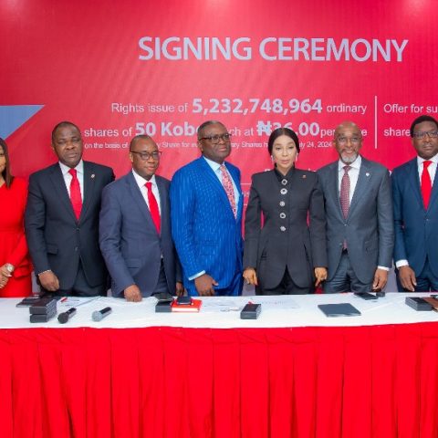 Zenith Bank Plc is set to raise N290 billion through a combination of a Rights Issue and a Public Offer in compliance with the revised minimum capital requirements for Nigerian commercial banks introduced by the Central Bank of Nigeria (CBN). This announcement was made during the Zenith Bank Rights Issue/Public Offer Signing Ceremony held yesterday, July 29, 2024, at The Civic Centre, Victoria Island, Lagos. This event marks a significant milestone in the bank’s previously announced capital-raising programme, aimed at bolstering its capital base and supporting its growth trajectory across its banking and non-banking subsidiaries. The Rights Issue offers 5,232,748,964 ordinary shares of 50 Kobo each at N36.00 per share, while the Offer for Subscription presents 2,767,251,036 ordinary shares of 50 Kobo each at N36.50 per share. The Rights Issue affords existing shareholders the opportunity to purchase additional shares in proportion to their current holdings and is being offered on the basis of one new ordinary share for every six existing ordinary shares held as of Wednesday, July 24, 2024. Conversely, the public offer for subscription is open to the general public and aims to attract new investors. Speaking at the signing ceremony, the Group Managing Director/CEO of Zenith Bank Plc, Dame (Dr.) Adaora Umeoji, OON, expressed enthusiasm about the Rights Issue and Public Offer, stating, “Today, we signed the transaction documents with respect to Zenith Bank’s N290 billion Rights Issue and Public Offer. This is slightly above the N230 billion required for us to meet the CBN’s minimum recapitalisation requirement. We are extremely pleased with the level of enthusiasm we have already seen from our existing shareholders for the Rights Issue. Beyond existing shareholders, incorporating a public offer is crucial to ensure that our customers, who are not yet shareholders, can have the opportunity to join in the ownership of this premium brand. “In terms of Tier-1 Capital, Zenith Bank has been adjudged by The Banker, Financial Times to be number one in Nigeria and the only Nigerian Bank in the top 600 banks globally. Over the years, we have consistently rewarded our esteemed shareholders. Specifically, in the last five years, we have maintained the record as the highest dividend-paying Bank in Nigeria. In 2023, we set a record as the only Nigerian Bank to pay a dividend of N4 per share.” She added that the proceeds from the capital raise will be channelled towards expanding banking operations across Africa and internationally, investing in technology infrastructure, and supporting working capital on an ongoing basis. She expressed optimism that given Zenith Bank’s track record of profitability and consistency in creating wealth for shareholders, the capital raise will be a resounding success. She assured prospective investors that Zenith Bank will maintain its leadership in dividend payout in the years ahead and encouraged them to invest in value and invest in Zenith Bank. She also expressed her profound gratitude to the Founder and Chairman, Dr. Jim Ovia CFR, whose vision over 34 years ago laid the foundation for a reputable, dominant, globally recognised financial institution known for innovation, superior performance, and the creation of premium value for all stakeholders. The Chief Executive of Stanbic IBTC Capital Limited, Mr. Oladele Sotubo, commended the management of Zenith Bank for their commitment to the transaction, which provides an opportunity for existing shareholders to consolidate their position and welcomes new investors to join the journey towards the future of Zenith Bank. He also expressed gratitude for the opportunity for Stanbic IBTC Capital Limited to lead and guide the execution of the transactions. Speaking further, he said, “A combined offer that is both a Rights Issue and a Public Offer confirms Zenith Bank’s position as a pacesetter and a role model, which will undoubtedly spur more transactions in the capital market.” The lead issuing house for the Rights Issue and Public Offer is Stanbic IBTC Capital Limited, with joint issuing houses including Quantum Zenith Capital & Investments Limited, CardinalStone Partners Limited, Meristem Capital Limited, Chapel Hill Denham Advisory Limited, Coronation Merchant Bank Limited and Vetiva Advisory Services Limited. The Offer will open on Thursday, August 1, 2024, and close on Monday, September 9, 2024. Zenith Bank has provided a robust suite of platforms for the Rights Issue and Public Offer. Applications can be made through any of Zenith Bank’s electronic channels: Zenith Bank Internet Banking, Zenith Bank Mobile Application, Zenith Bank Corporate Internet Banking, Zenith Bank Branches nationwide and NGX Invest platform. The Zenith Bank E-Application channels have been integrated into the NGX Invest platform, which can be accessed at https://invest.ngcgroup.com, and are available to all applicants and authorised receiving agents to submit applications on behalf of applicants. The electronic channels democratises the distribution of public offers and rights issues in the capital market, enabling investors to subscribe with the click of a button. R – L: Executive Director, Zenith Bank Plc, Mr. Louis Odom; Executive Director, Mr. Akin Ogunranti; Managing Director/Chief Executive, Vetiva Advisory Ltd, Mr Chuka Eseka; Group Managing Director/Chief Executive, Zenith Bank Plc, Dame (Dr.) Adaora Umeoji, OON; Group Managing Director, Meristem Securities Ltd, Mr Wole Abegunde; Company Secretary, Mr. Micheal Otu; Executive Director, Stanbic IBTC Capital Limited, Mrs Oyindamola Akinyemi; Executive Director, Mr. Henry Oroh; Executive Director, Mrs. Adobi Nwapa; and Executive Director, Mr. Adamu Lawani during the Zenith Bank Capital Raising Signing Ceremony at the Civic Centre, Victoria Island, Lagos, yesterday.